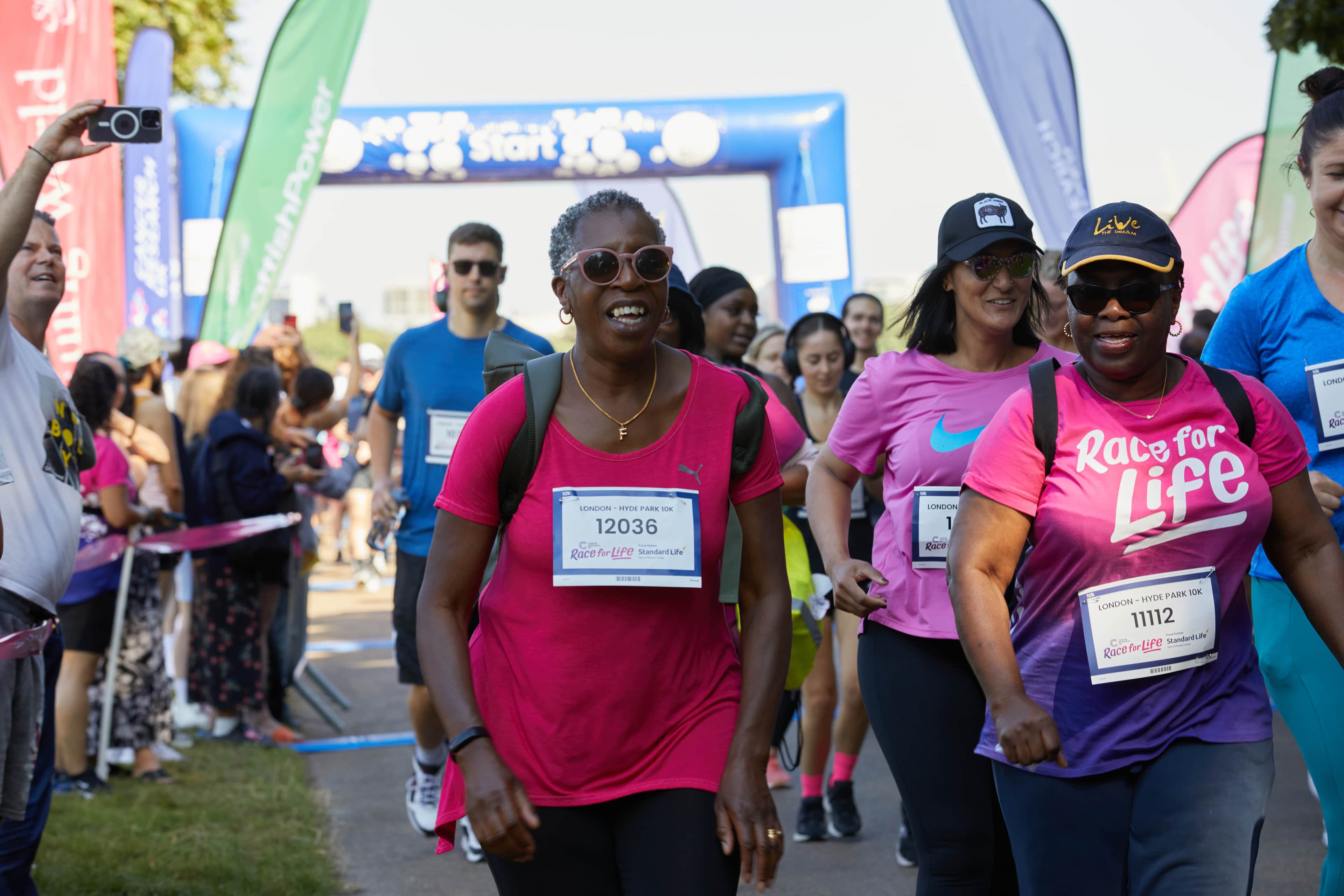 Race for Life participants crossing the start line.