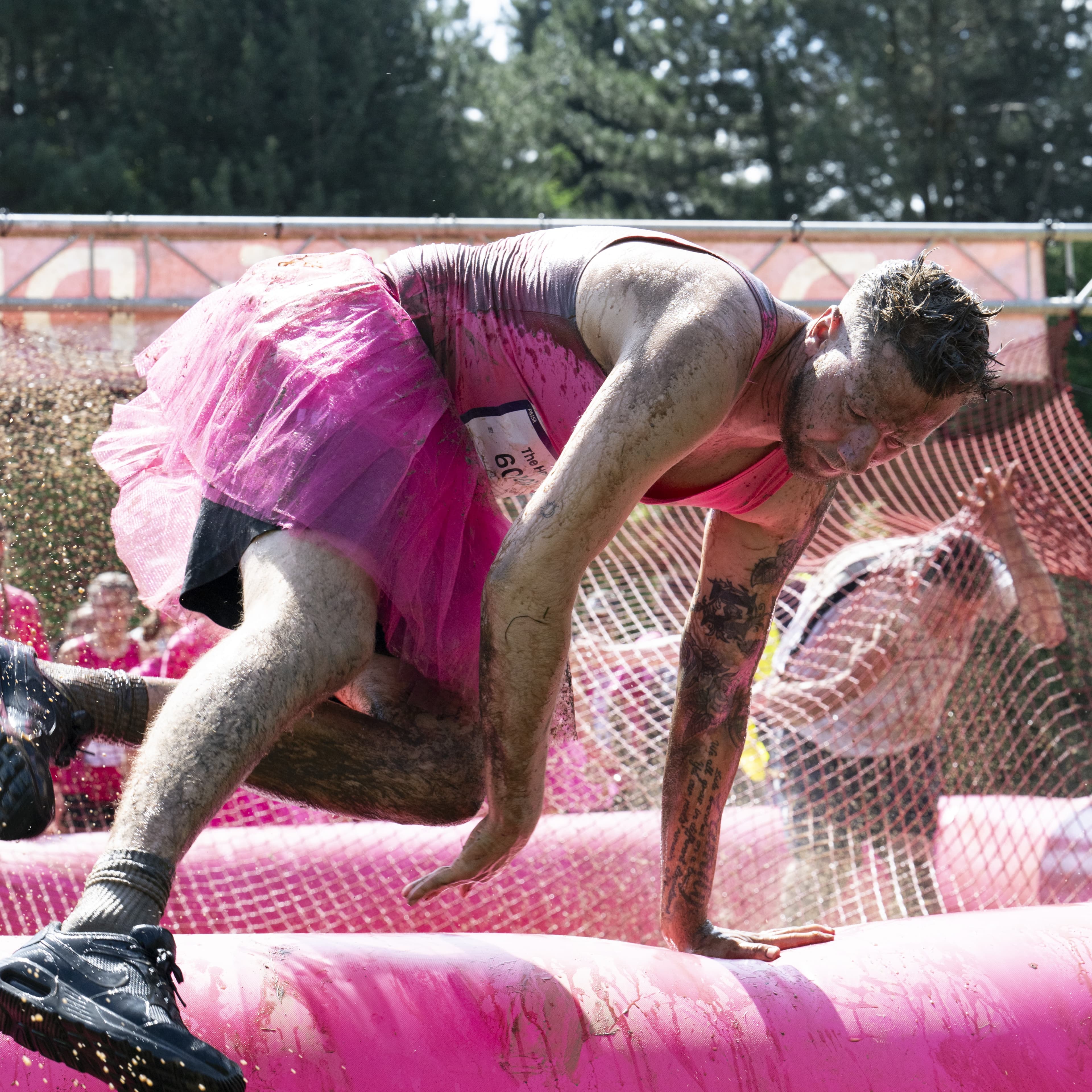 supporters in inflatable pit.